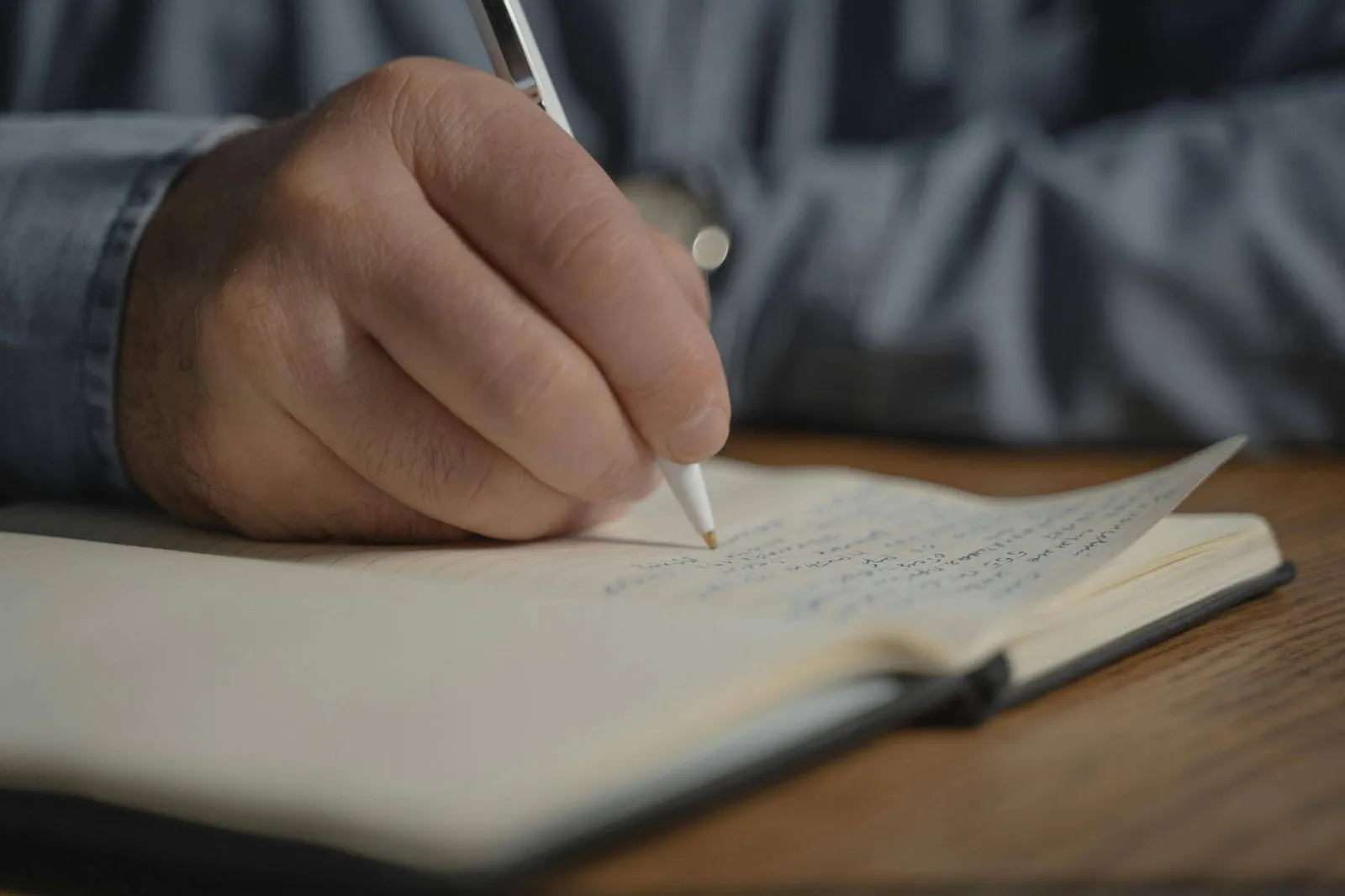 Business Tax Planning 2 Hand writing with a pen on notebook